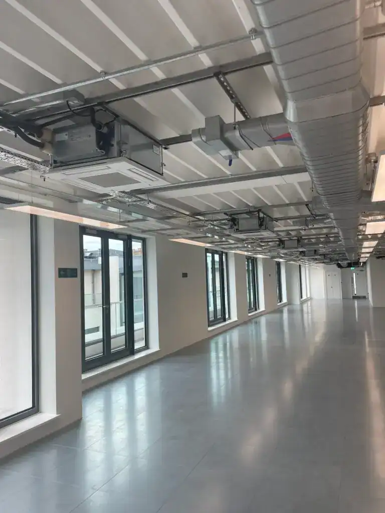 Open-plan London office stripped back to Cat A condition with new suspended ceiling and raised access floor